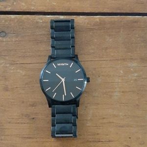 Classic black rose mens MVMT watch with steel band